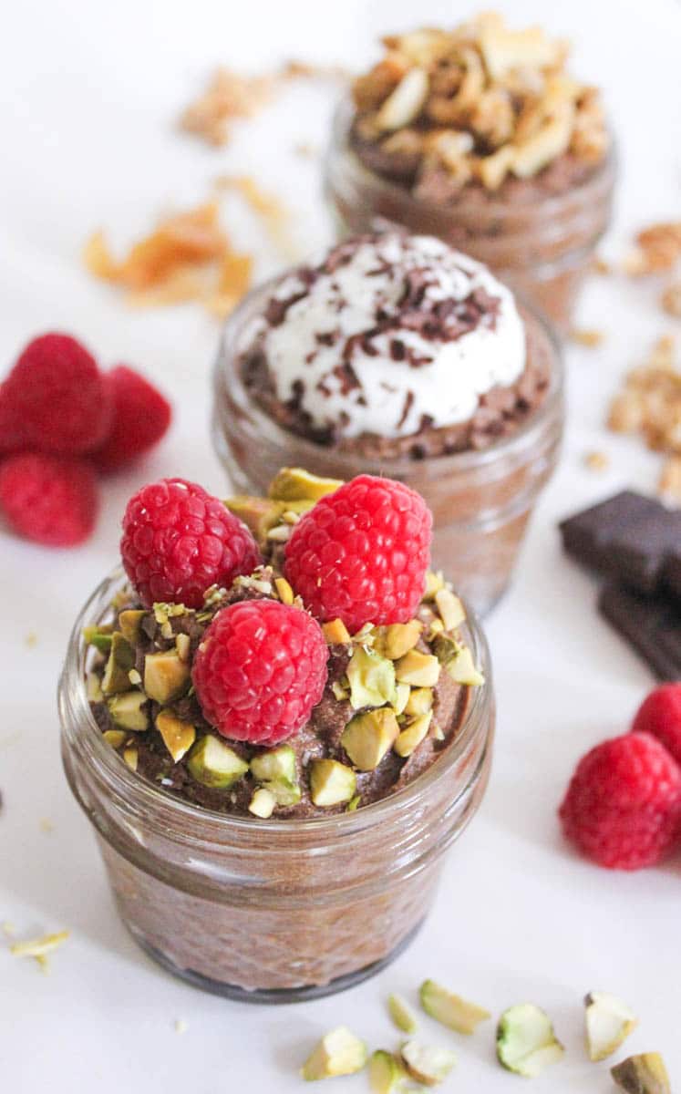 Chocolate Avocado Chia Seed Pudding with three different toppings.