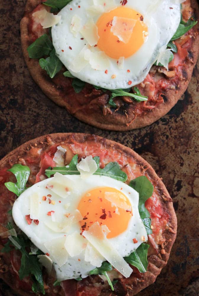 grilled-pita-pizzas-with-prosciutto-chanterelles-arugula-and-a-fried-egg