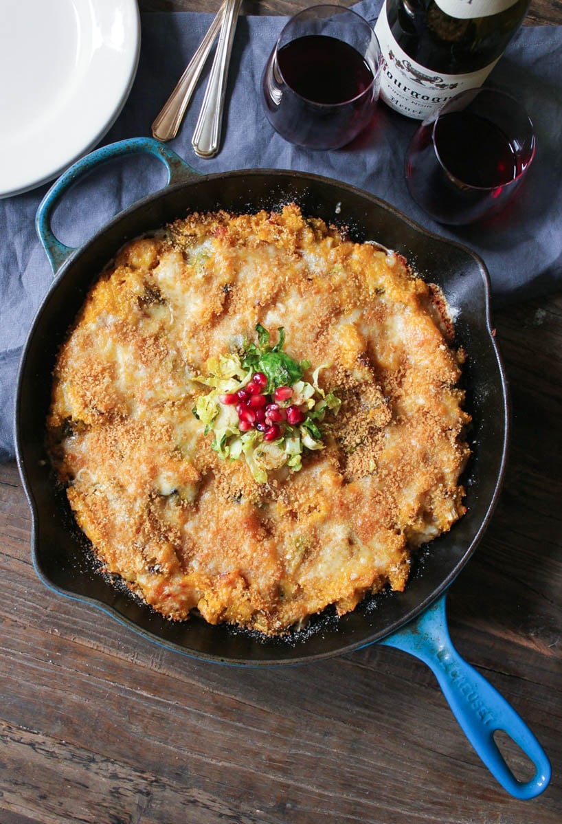 Overhead view of Kabocha Squash Quinoa Bake with Brussels Sprouts and Pancetta in a skillet. 