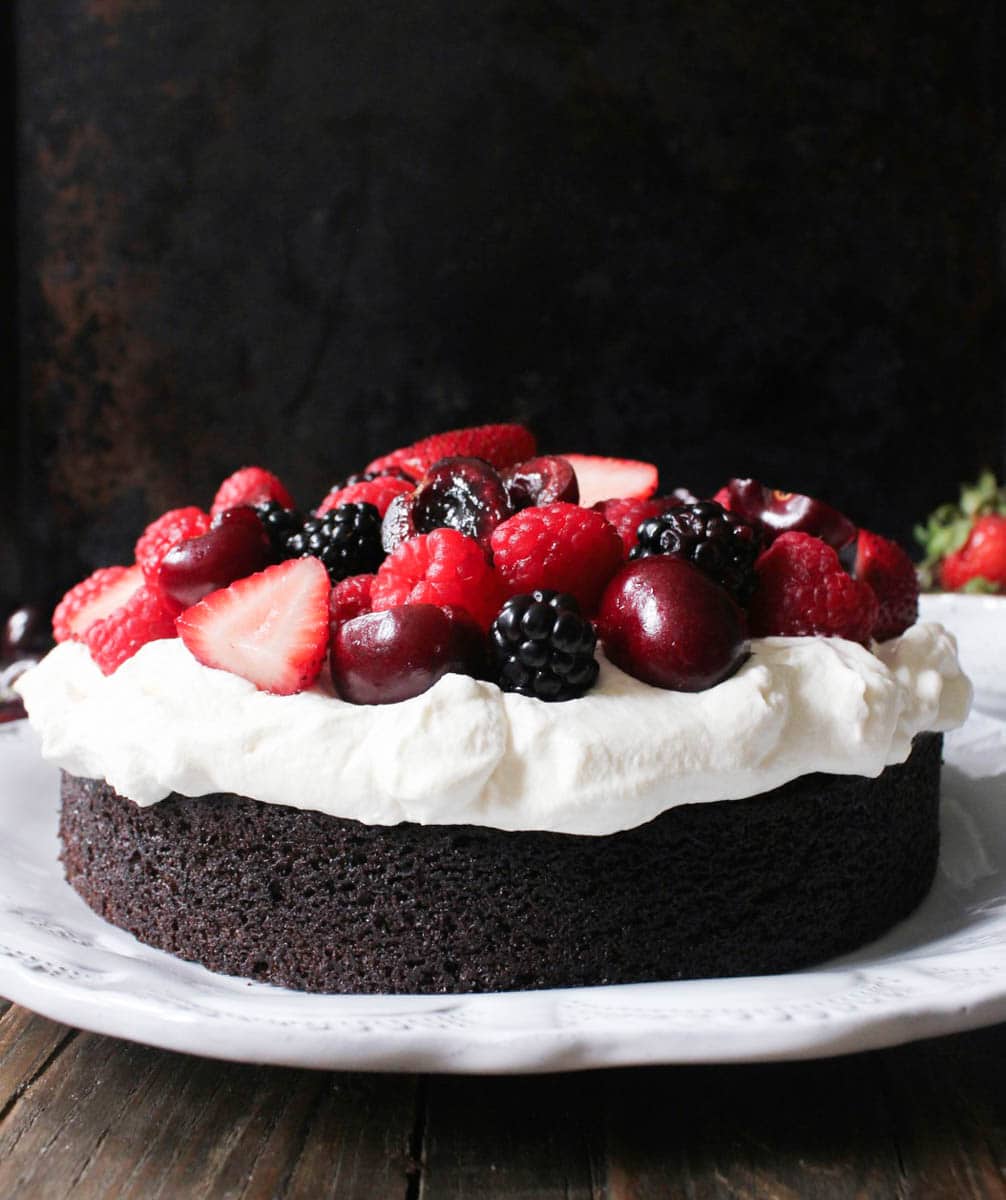 vegan-chocolate-cake-with-whipped-coconut-cream-and-fresh-berries