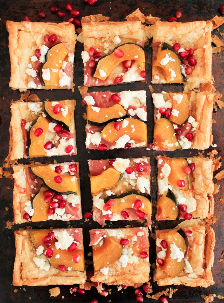 Acorn Squash Tart with Prosciutto and Pomegranate sliced and ready to serve.