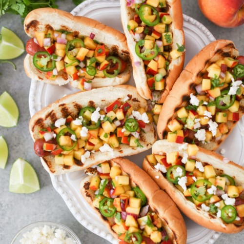 https://domesticate-me.com/wp-content/uploads/2018/07/Grilled-Hot-Dogs-with-Peach-Jalapen%CC%83o-Salsa-2-500x500.jpg